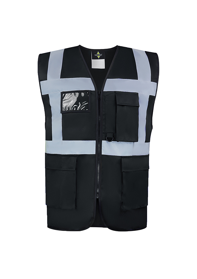 A woman wears a pink Korntex safety vest with reflective stripes in a warehouse