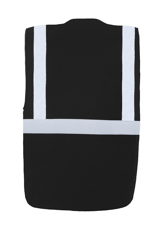 Adult in signal yellow, lined Korntex safety vest with zip fastener in an industrial environment