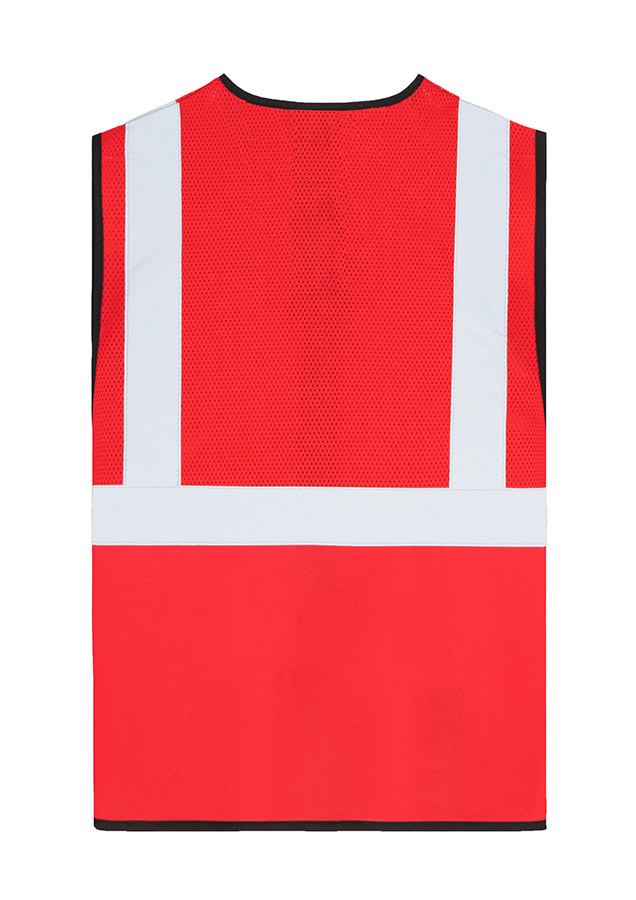 Adult worker with orange Korntex mesh multifunctional safety vest and helmet holding a tool on a railway site in front of a train