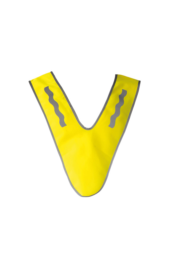A child wearing a yellow Korntex multi-use collar with reflective strips is standing in a park.