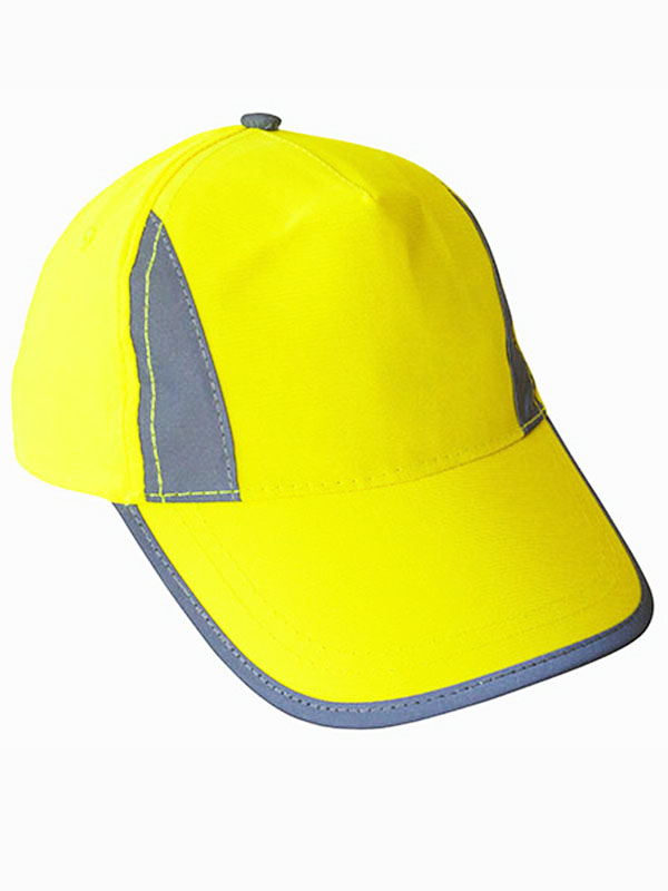 Portrait of a smiling boy with reflective signal yellow Korntex cap in the park
