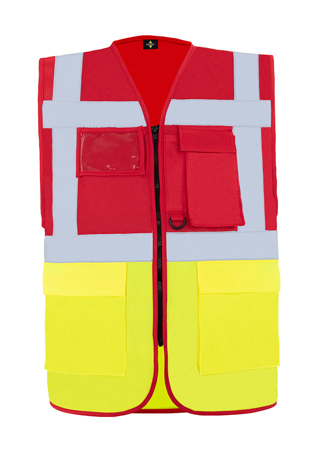 A woman wears a pink Korntex safety vest with reflective stripes in a warehouse