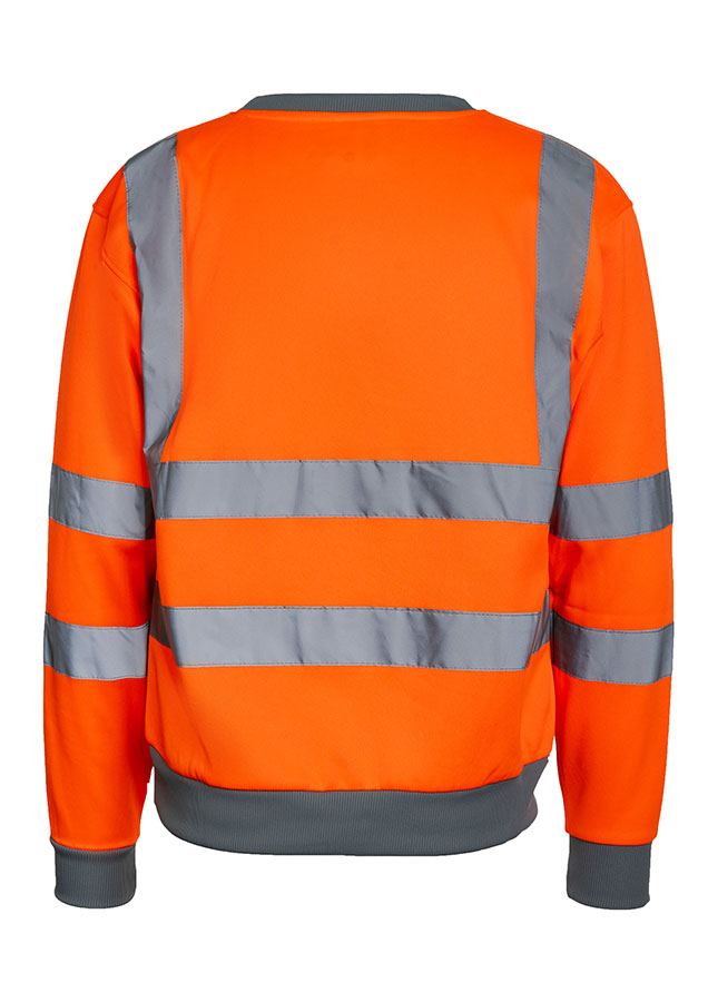 Adult man wearing a signal yellow Korntex Hi-Vis sweatshirt and white helmet on a construction site