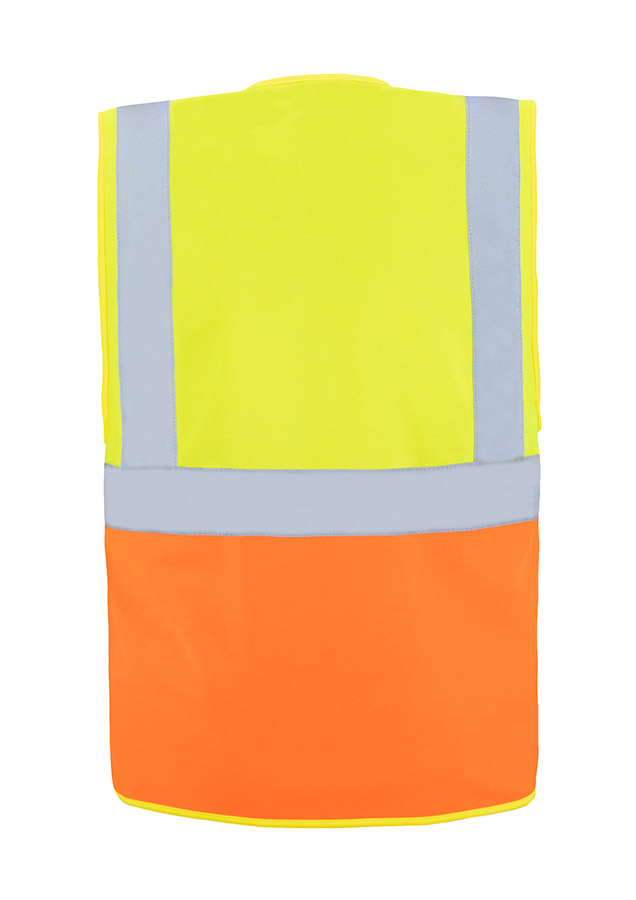 A woman wears a pink Korntex safety vest with reflective stripes in a warehouse