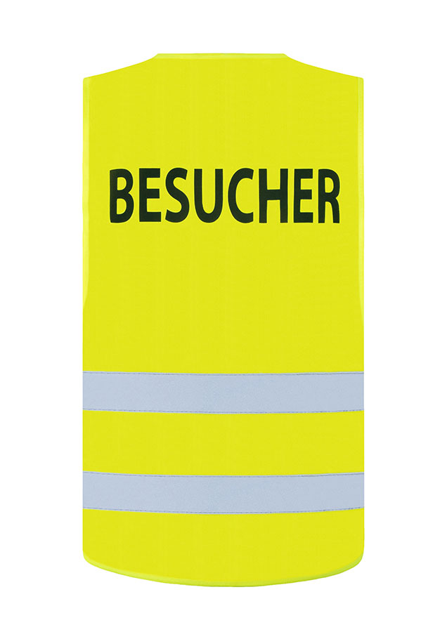 Adult in yellow printable Korntex safety vest in industrial environment