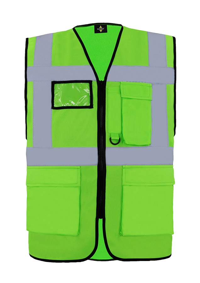 A woman wears a pink Korntex safety vest with reflective stripes in a warehouse