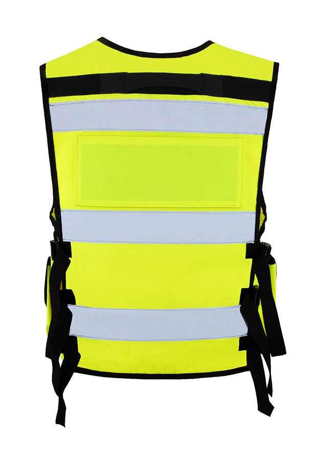 Adult in orange Korntex tactical safety vest with zip on a construction site