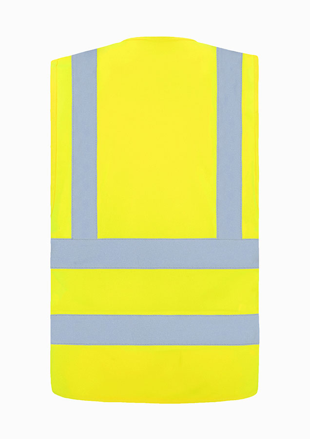 Adult man in fluorescent signal yellow Korntex safety vest standing in front of large metal containers