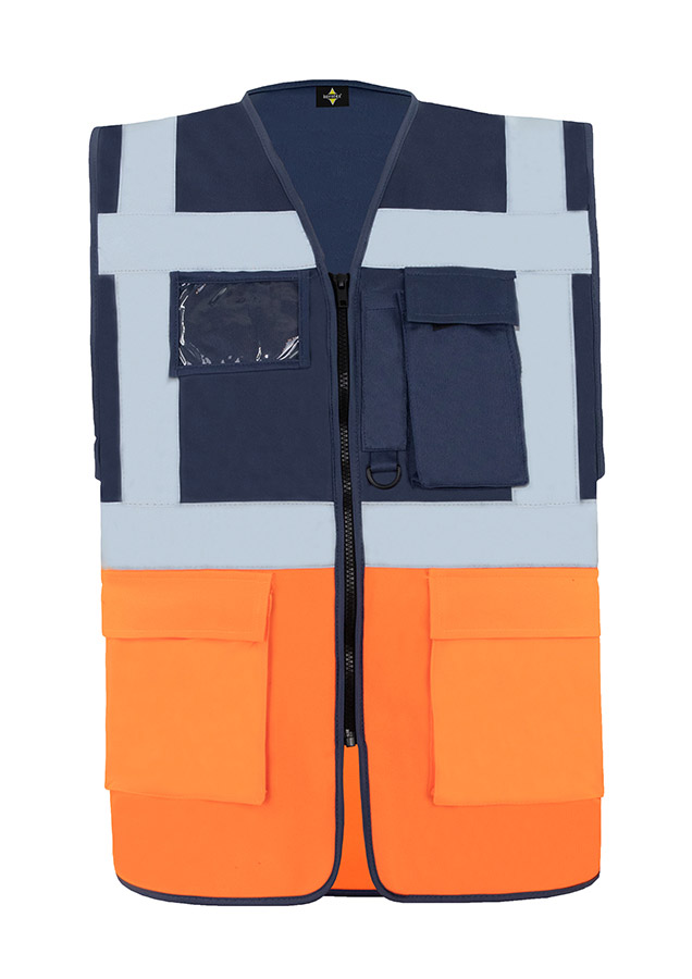A woman wears a pink Korntex safety vest with reflective stripes in a warehouse