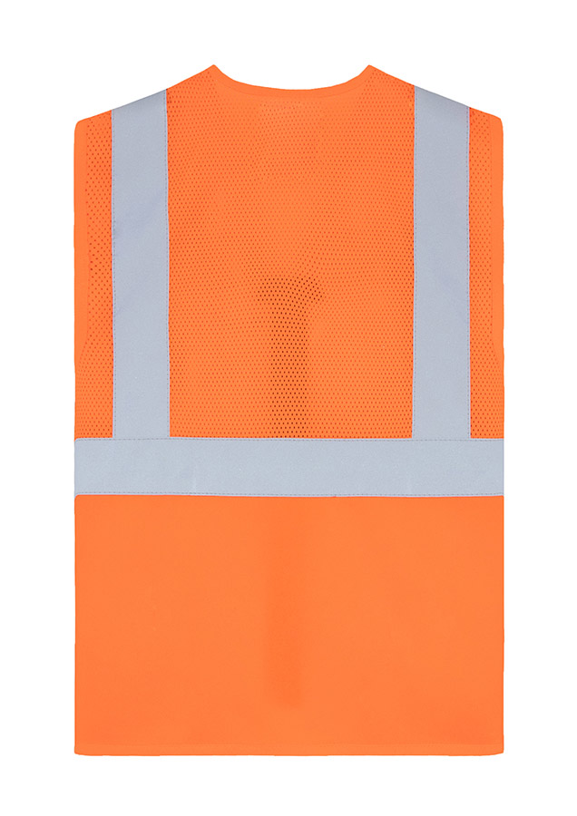 Adult worker with orange Korntex mesh multifunctional safety vest and helmet holding a tool on a railway site in front of a train