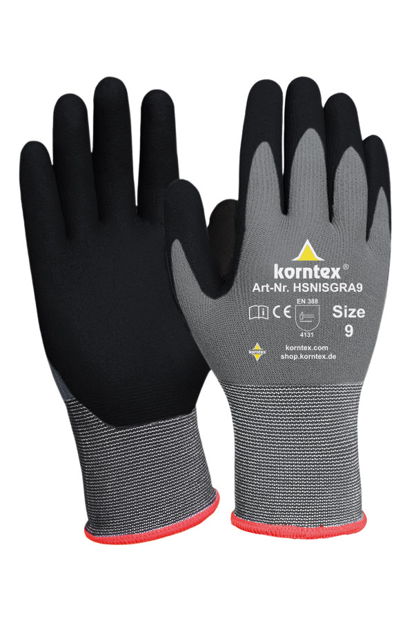A man with grey-black Korntex gloves holds a walkie-talkie