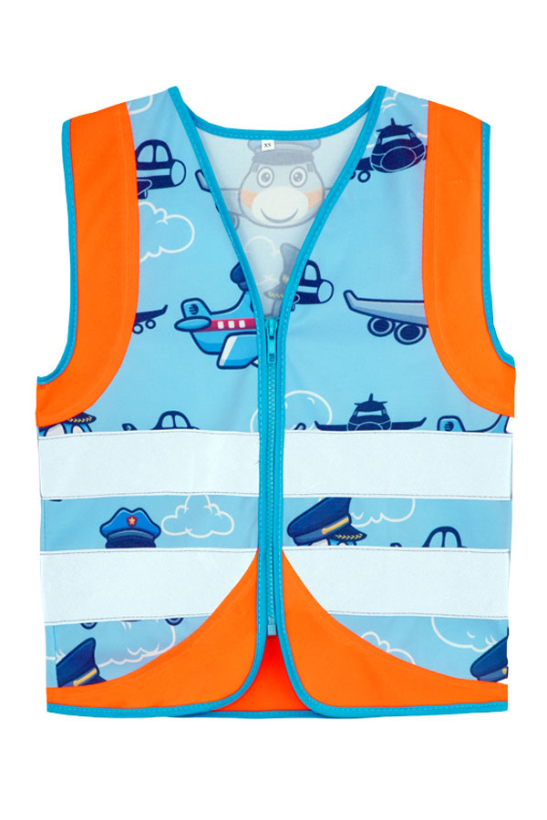 Child in an orange Korntex safety vest with an aeroplane pattern in a playground
