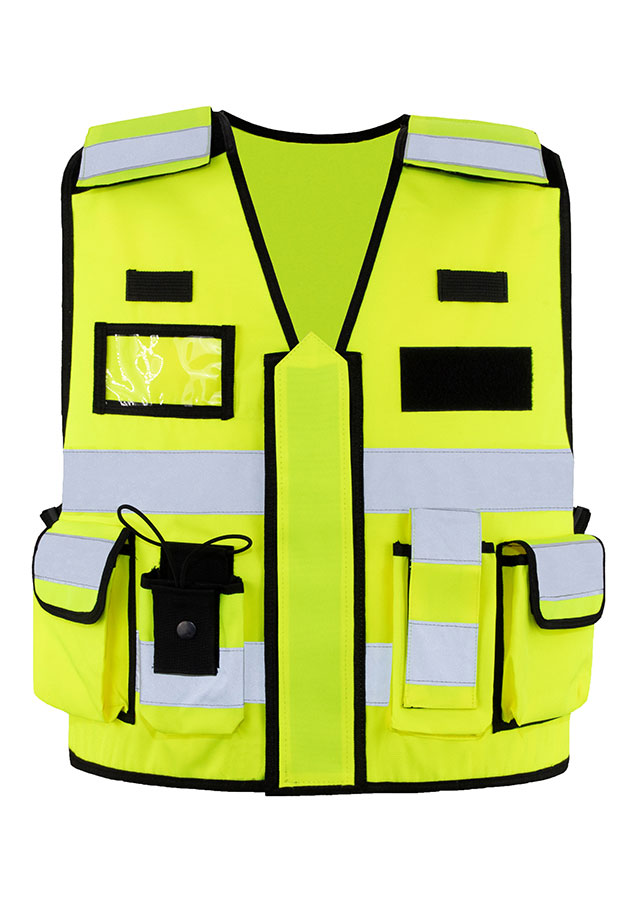 Adult in orange Korntex tactical safety vest with zip on a construction site