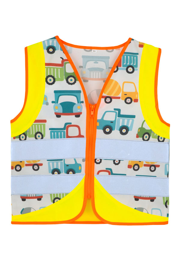 Child in a yellow Korntex safety vest with a construction vehicle pattern on a playground