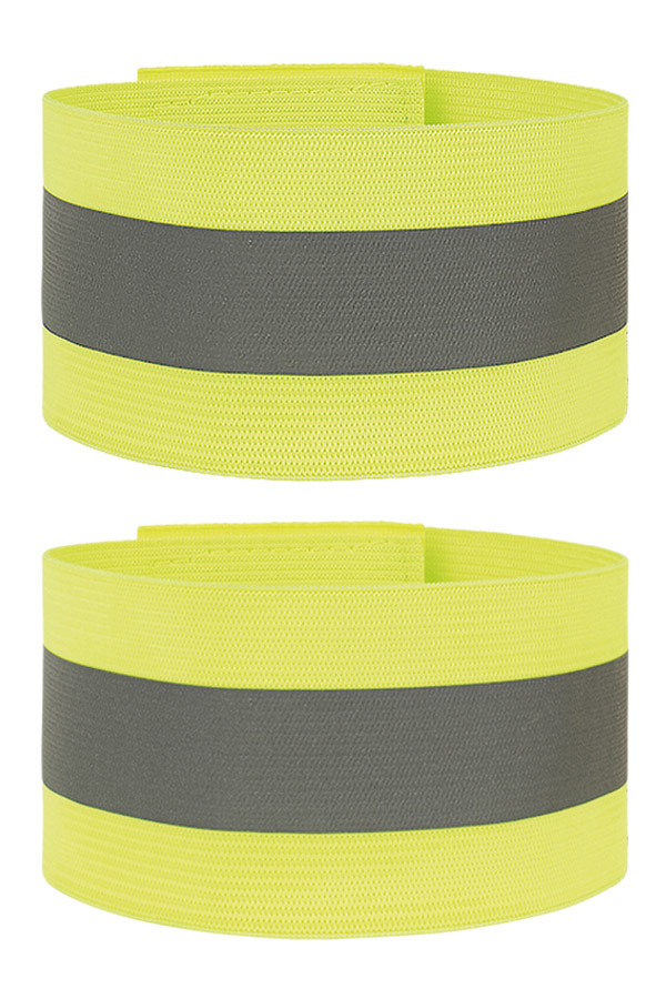 Adult woman wears Korntex safety vest bands on her body and upper arms