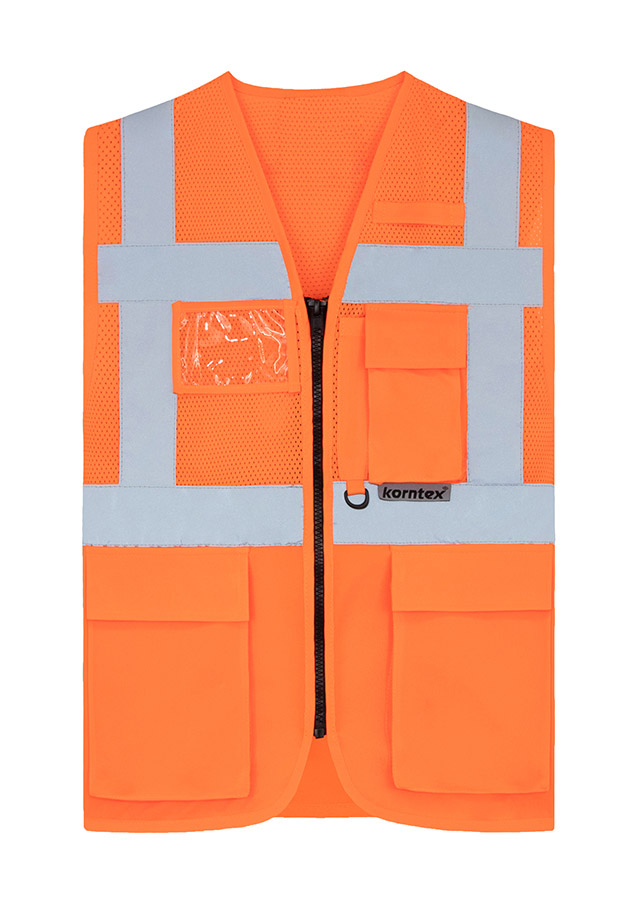 Adult worker with orange Korntex mesh multifunctional safety vest and helmet holding a tool on a railway site in front of a train