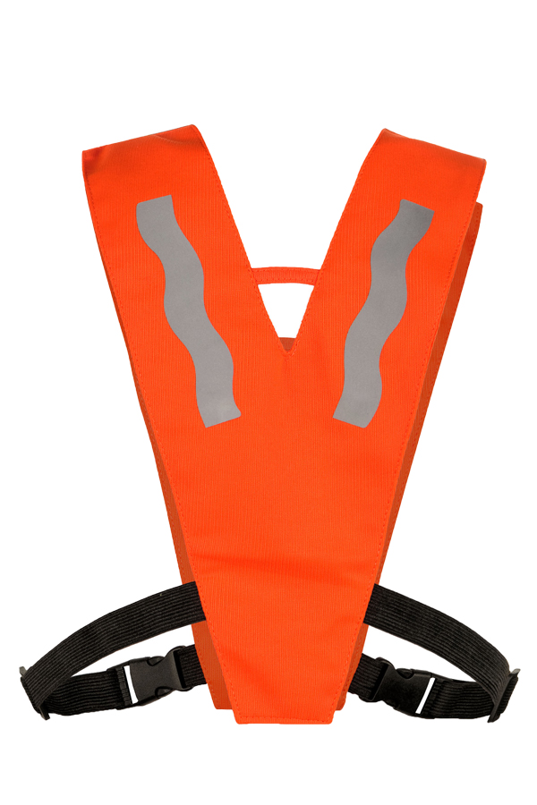 A child wearing an orange Korntex multifunctional collar with reflective stripes is standing in a park.