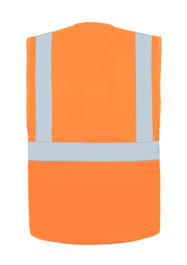 A woman wears a pink Korntex safety vest with reflective stripes in a warehouse