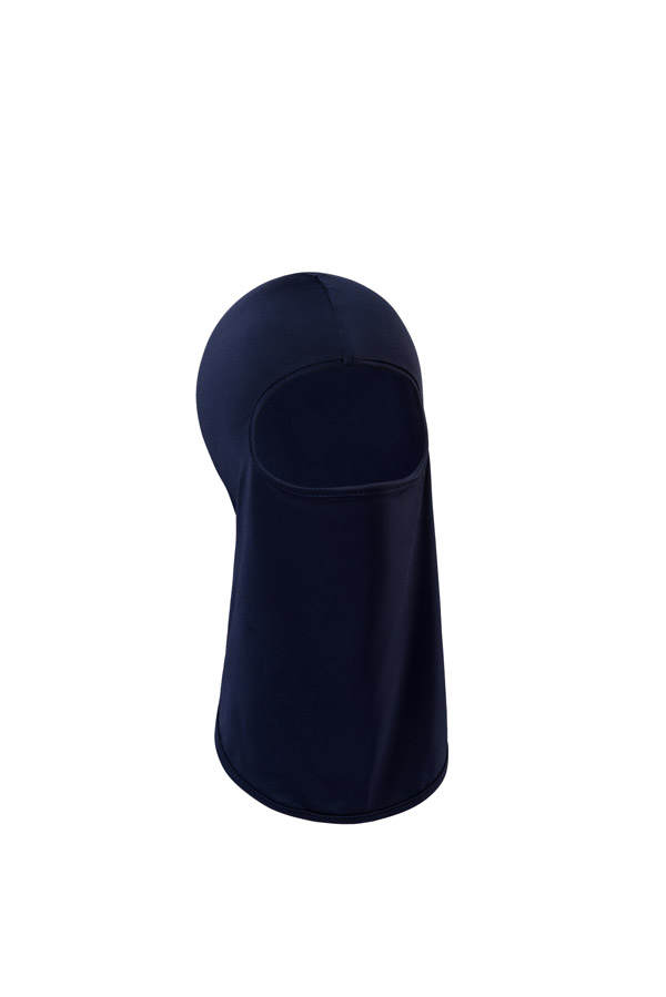 Portrait of an adult man wearing a black Korntex balaclava against a dark background