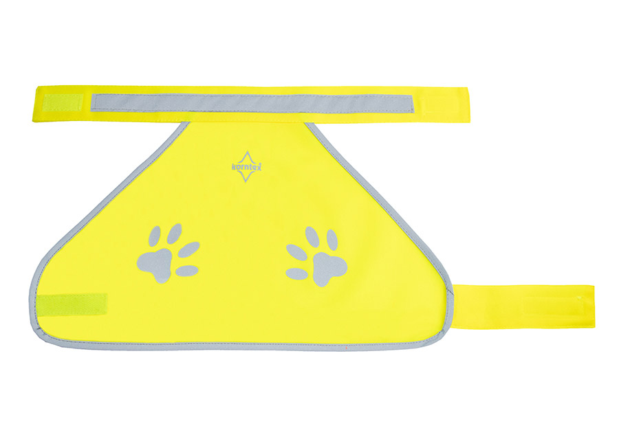 A dog wearing an yellow Korntex functional vest in a park.