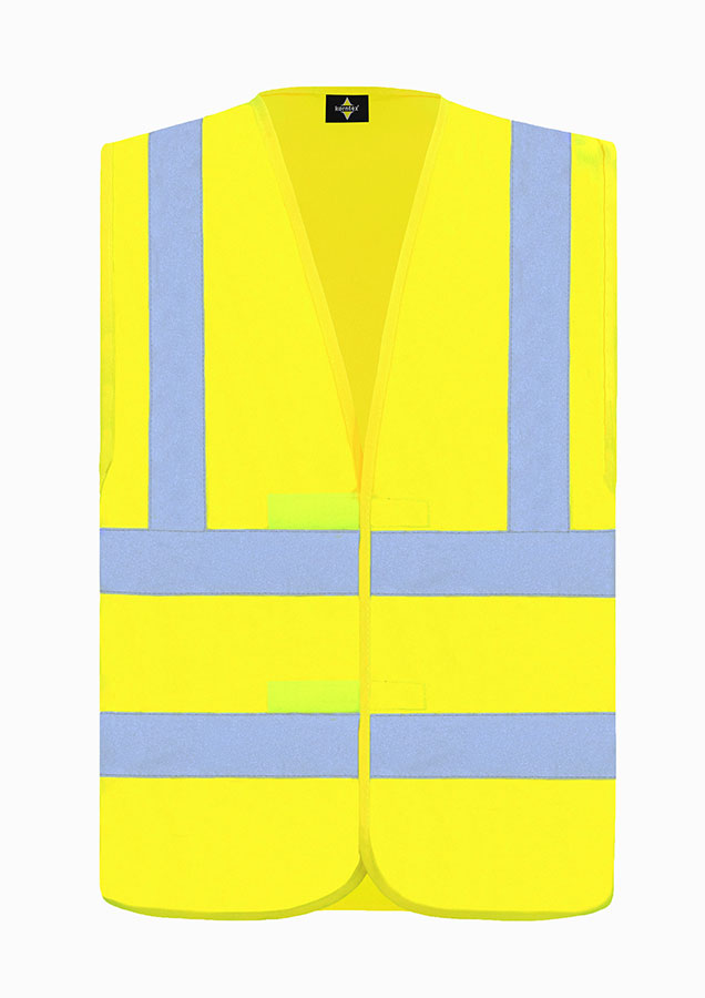 Adult man in fluorescent signal yellow Korntex safety vest standing in front of large metal containers
