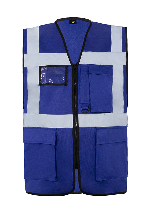 A woman wears a pink Korntex safety vest with reflective stripes in a warehouse