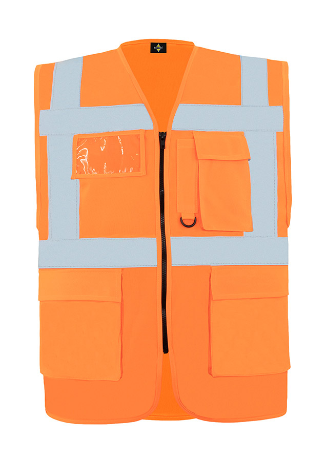 A woman wears a pink Korntex safety vest with reflective stripes in a warehouse
